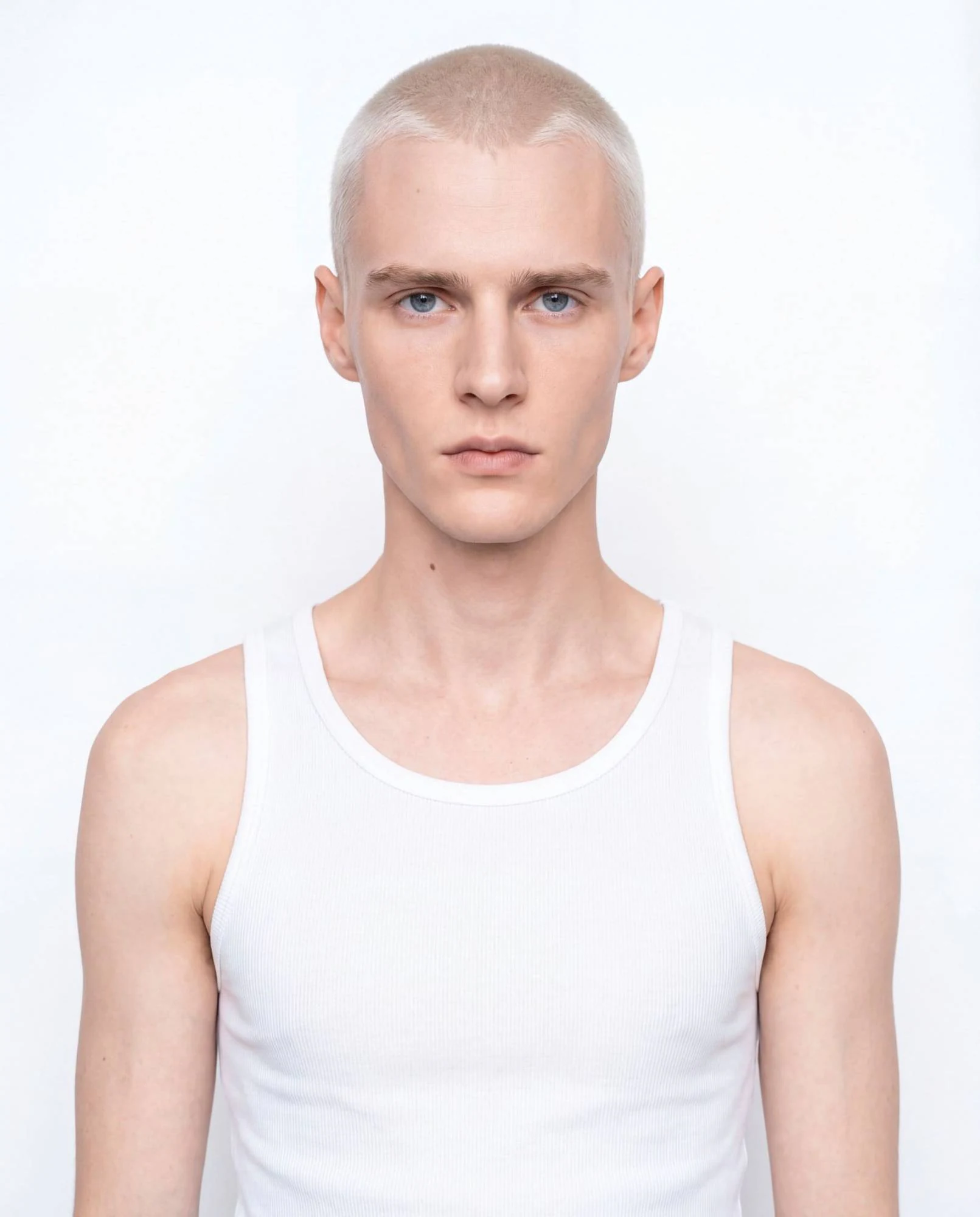 Virtual model, man with short bleached-blond hair, in a white tank top