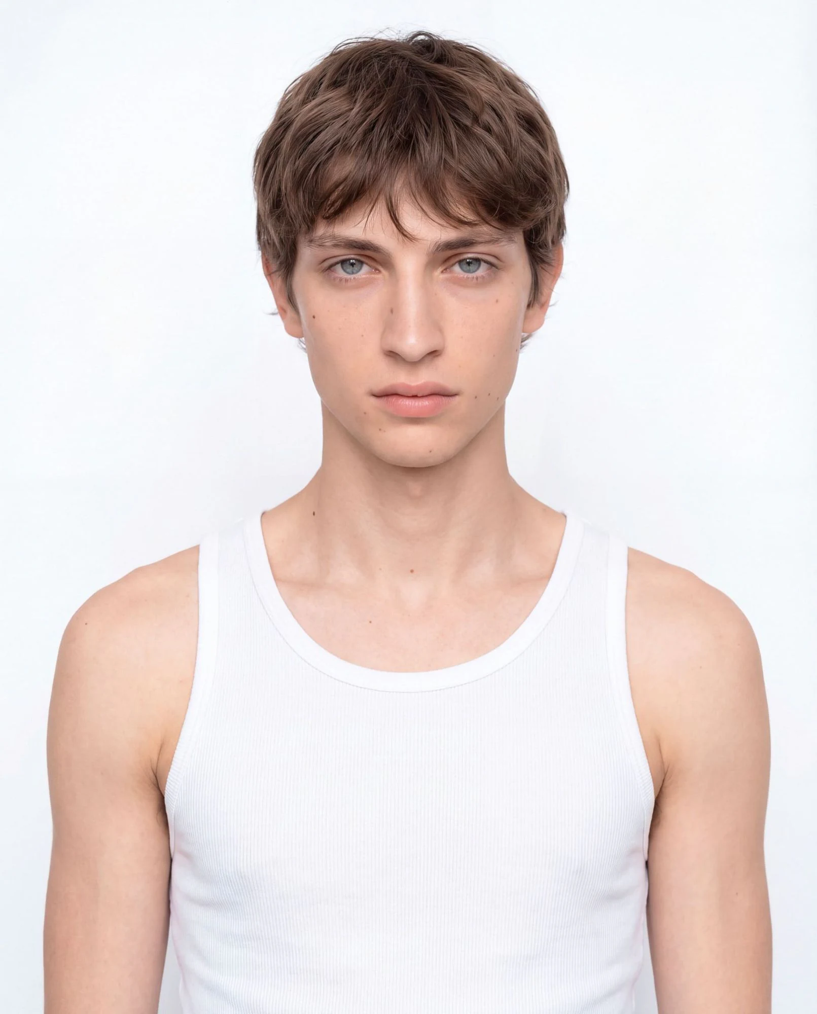 Virtual model, man with a brown fringe and grey eyes, in a white tank top