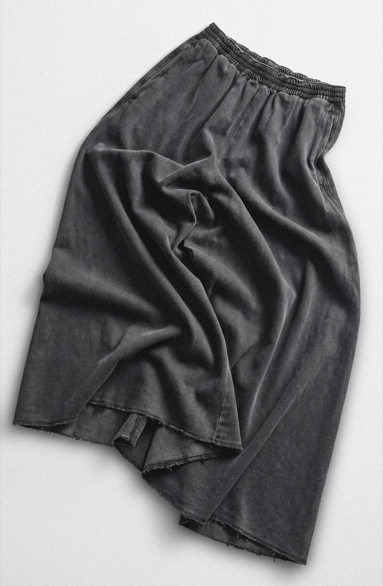 Washed black denim midi skirt laid flat