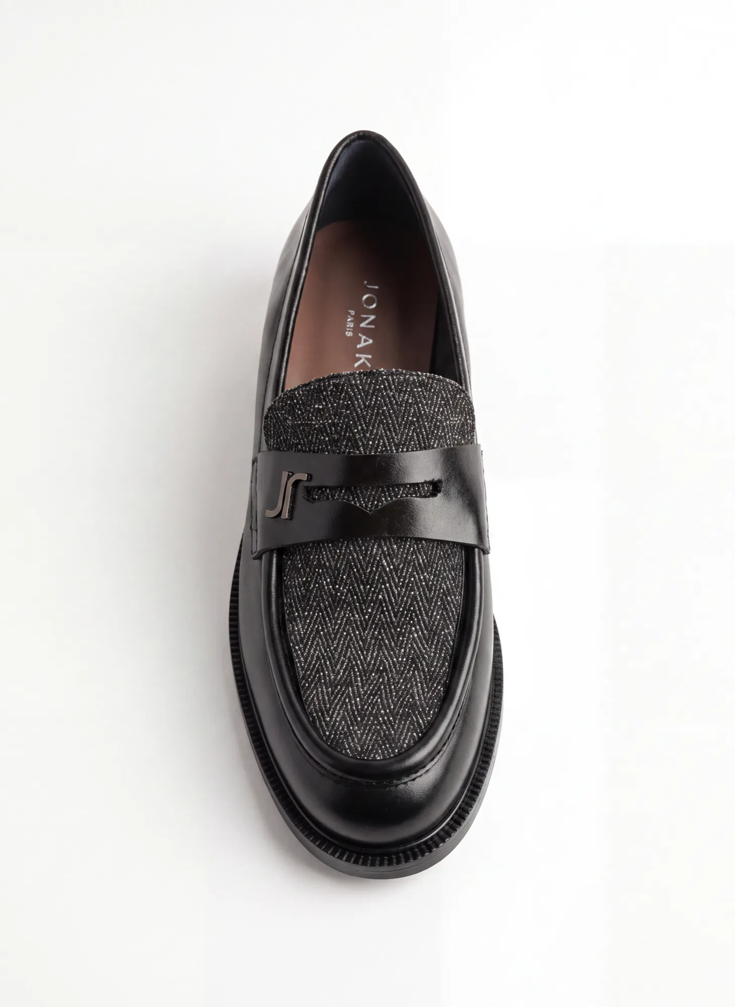 Pair of black leather loafers with tweed straps